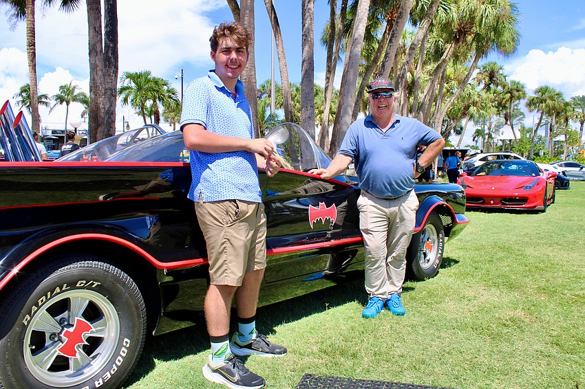 Garrett and Eugene Nock bring smiles to visitors of all ages at the Exotic Cars on the Circle show on Sept. 6 with the iconic Batmobile, a staple a local car shows.