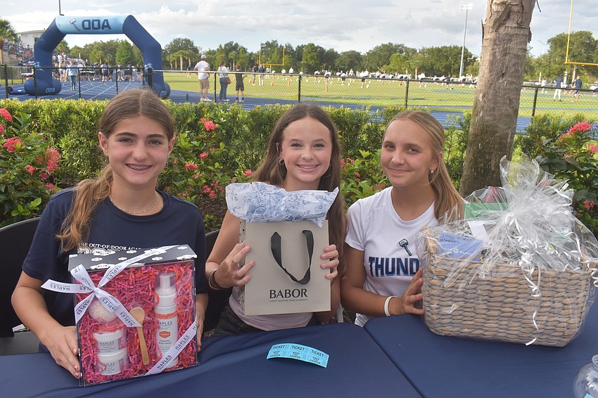 The Out-of-Door Academy freshmen students Charlotte Faucher, Mya Gruber and Keonna Antipov worked the raffling table. Antipov said she is inspired to volunteer for something similar in the future.