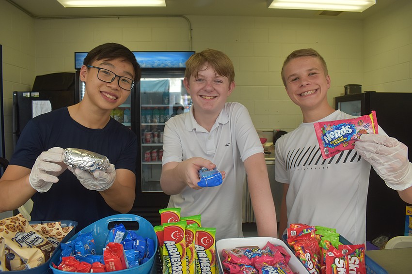 The Out-of-Door Academy concession stand volunteers were Julian Nguyen, Caleb Caserta and Oscar Pinckney. A portion of the concession stand's earnings were added on to the online donations and money from the raffle to be donated to the Suncoast Disaster Recovery Fund.